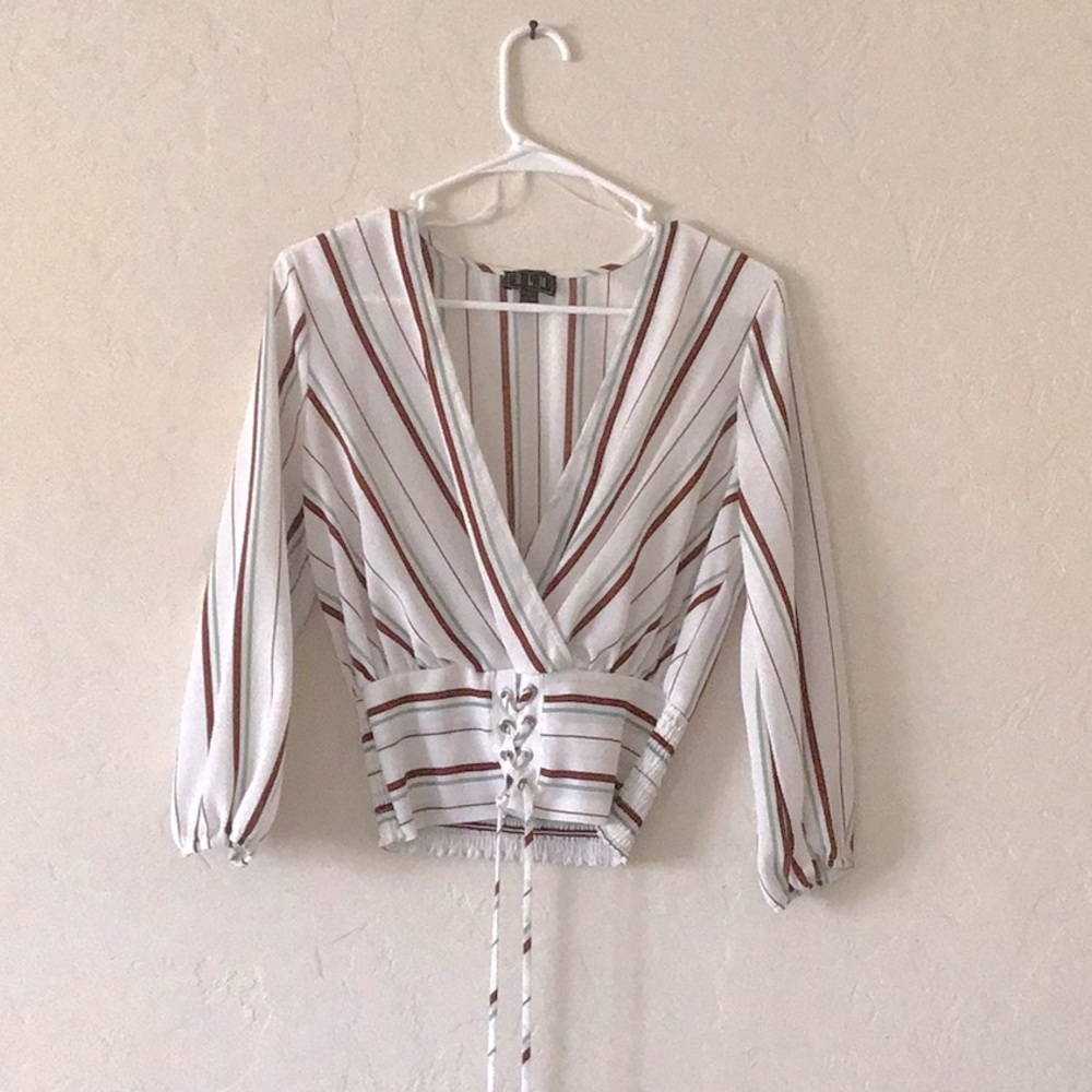 White blouse with different colored stripes with corset bottom